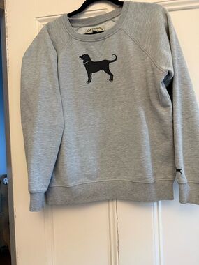 The Black Dog Cream Label with Black Dog Graphic and Red Collar